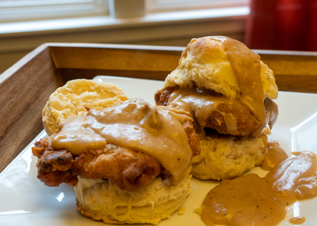 Fried chicken and gravy on a biscuit.