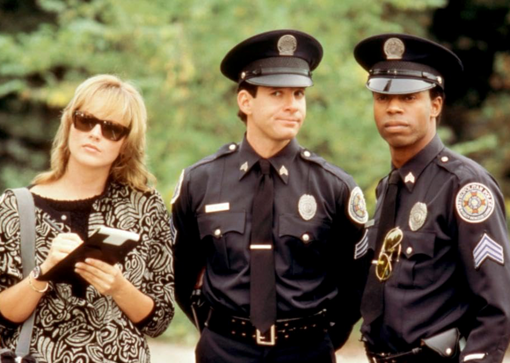 #13. Police Academy 4: Citizens on Patrol (1987) Sharon Stone, Steve Guttenberg, and Michael Winslow in ‘Police Academy 4: Citizens on Patrol’.