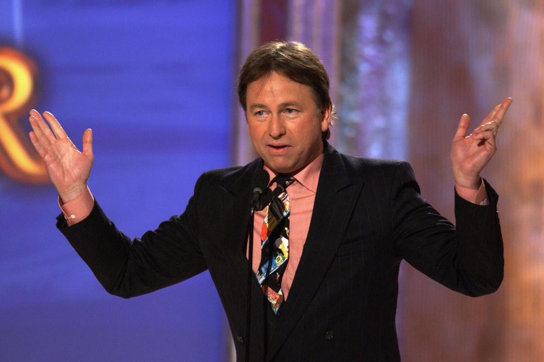 John Ritter gestures onstage.