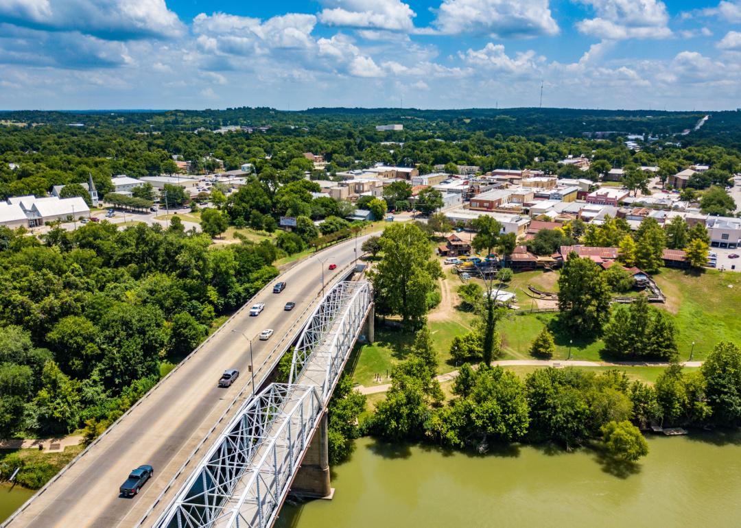 Aerial view of road and bridge over river in Bastrop.