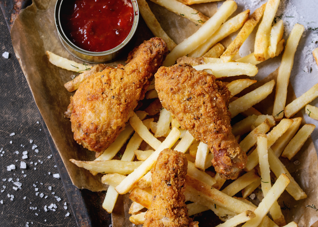 Tray of fried chicken and French fries.