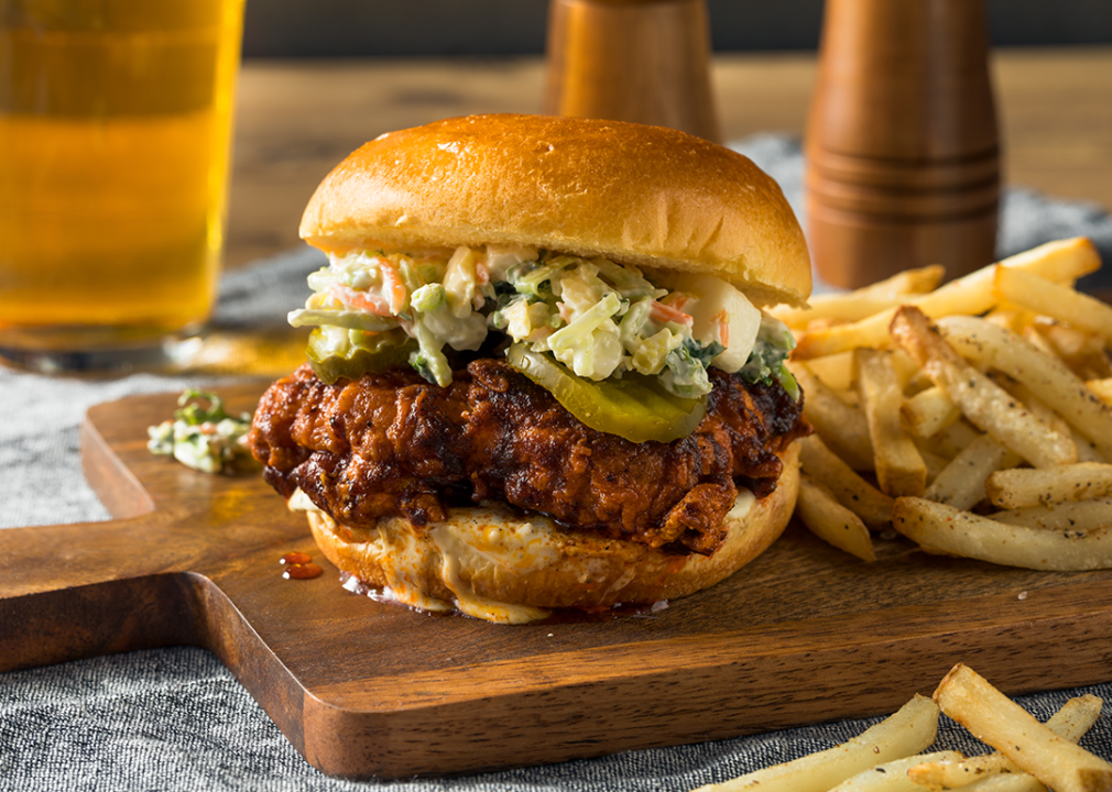 Spicy Nashville hot chicken sandwich with ranch dressing and pickles.