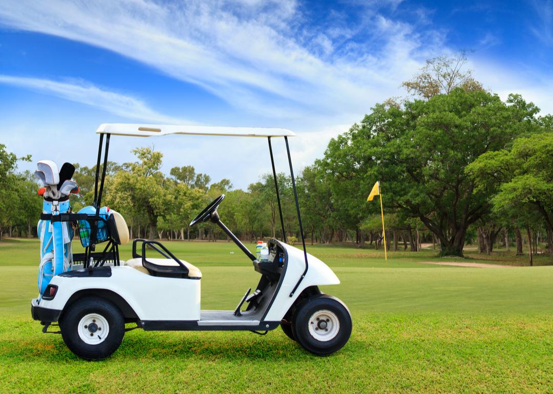 A lone golf cart on a golf course in Lake Success, New York.