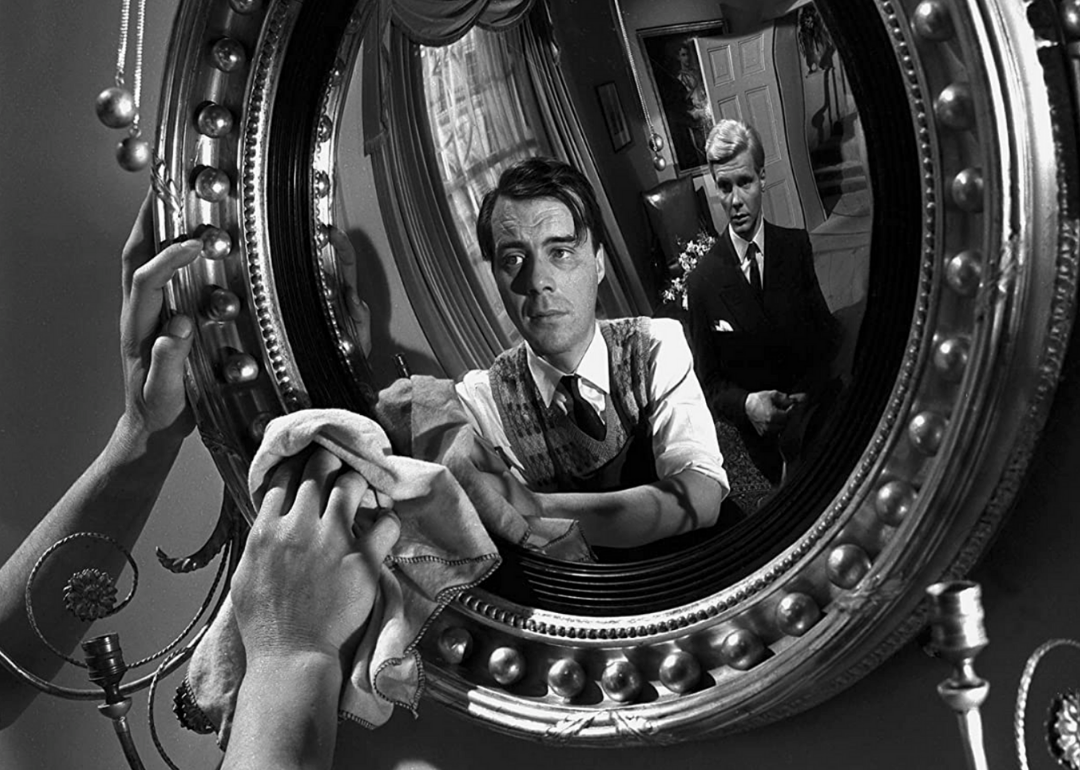 Actors Dirk Bogarde and James Fox in a scene from ‘The Servant.