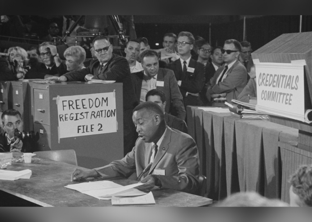 Aaron Henry, chair of the Mississippi Freedom Democratic Party delegation, reading from a document while seated before the Credentials Committee at the 1964 Democratic National Convention, Atlantic City, New Jersey, on Aug. 22, 1964.