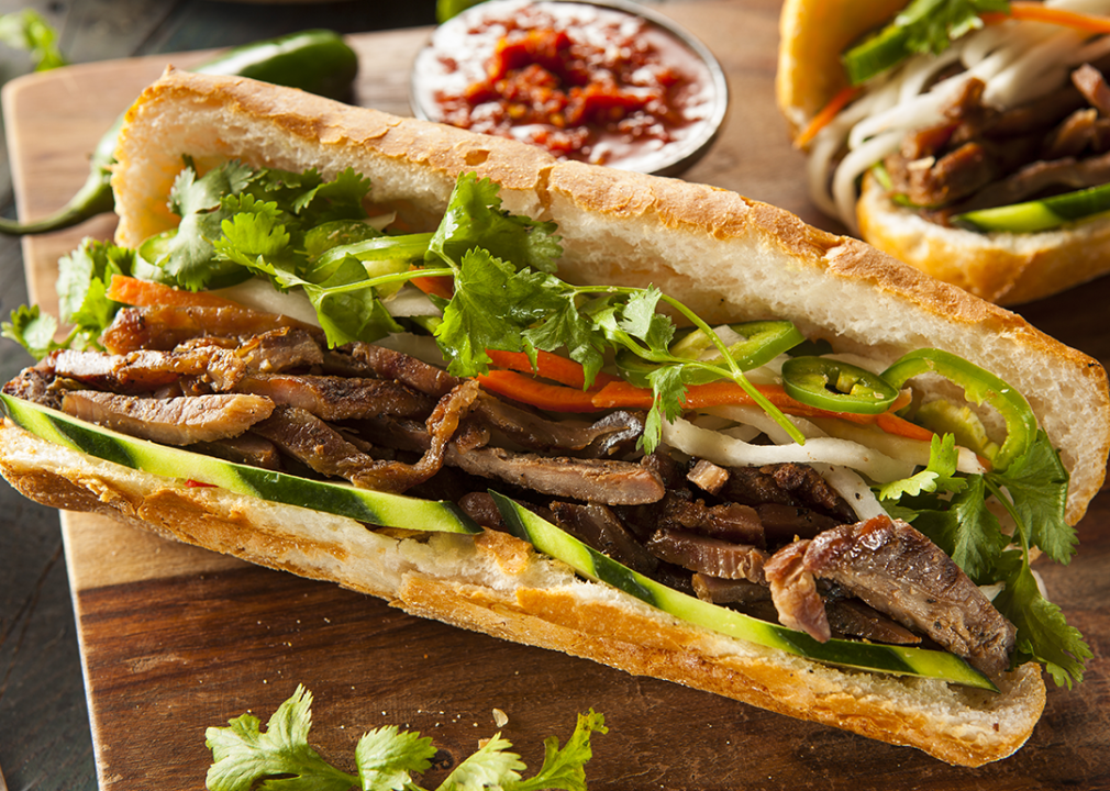 Banh mi sandwich with cilantro and daikon on a crusty roll.