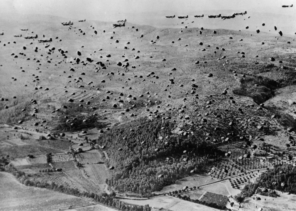 Allied soldier parachutes and supplies fill the sky over the beachhead between Marseilles and Nice during the Allied Invasion of France in August 1944.