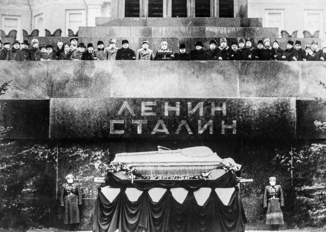Political leaders and colleagues stand at Lenin’s tomb with body of Joseph Stalin.