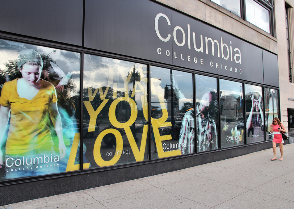 Person walks past Columbia College in Chicago.