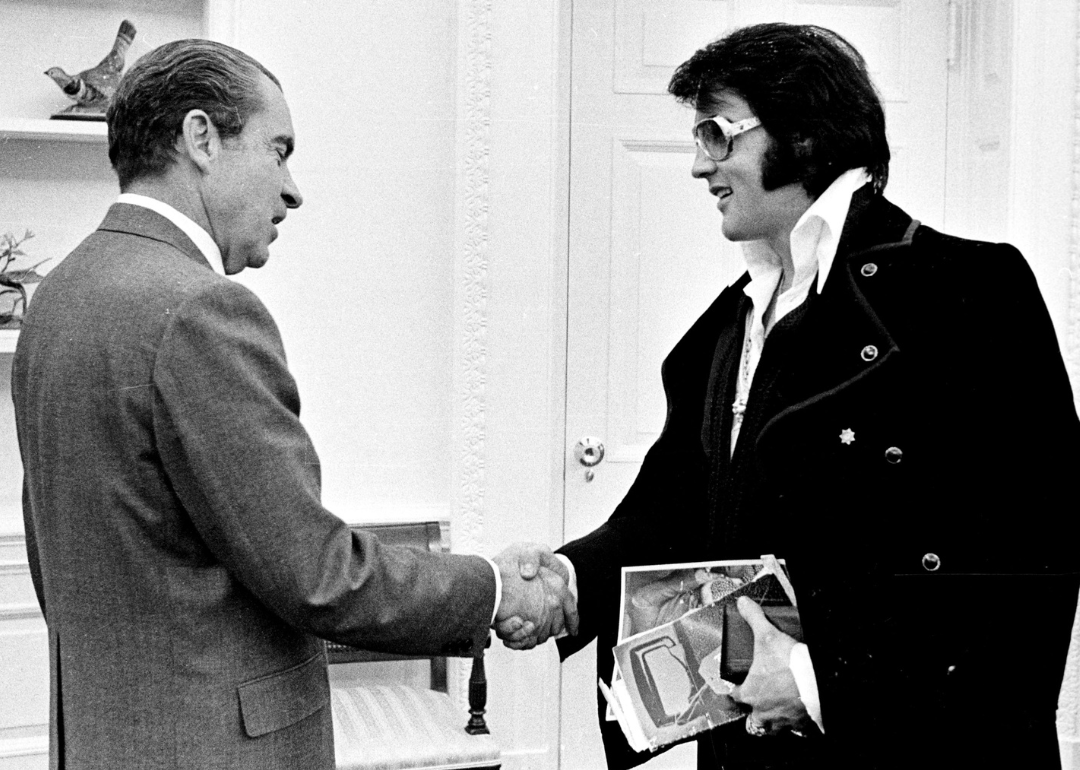 President Richard Nixon greets Elvis Presley in the White House.