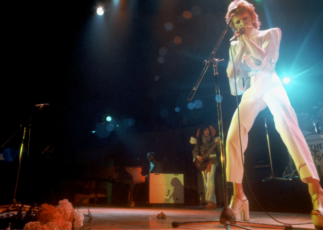 David Bowie performs on stage.
