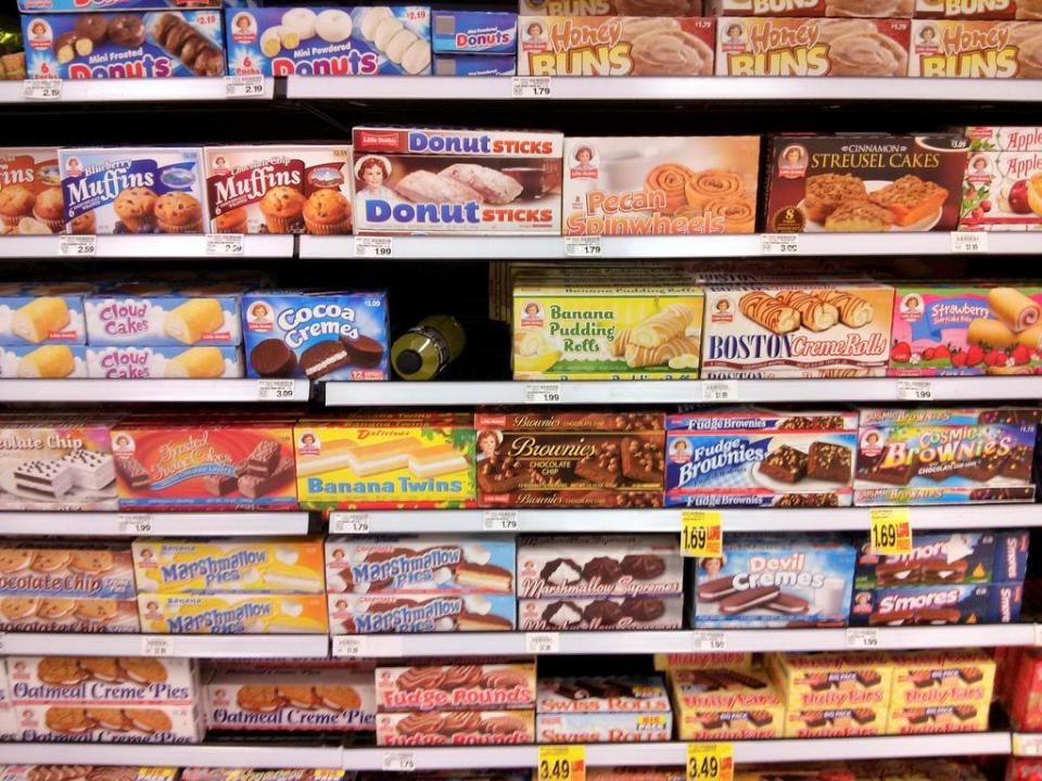 A shopping aisle of assorted boxed sweets.