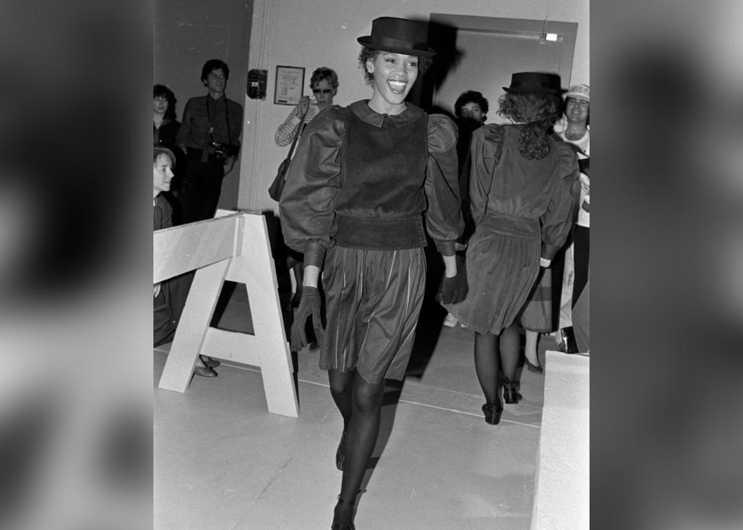 Whitney Houston walking in a fashion show.