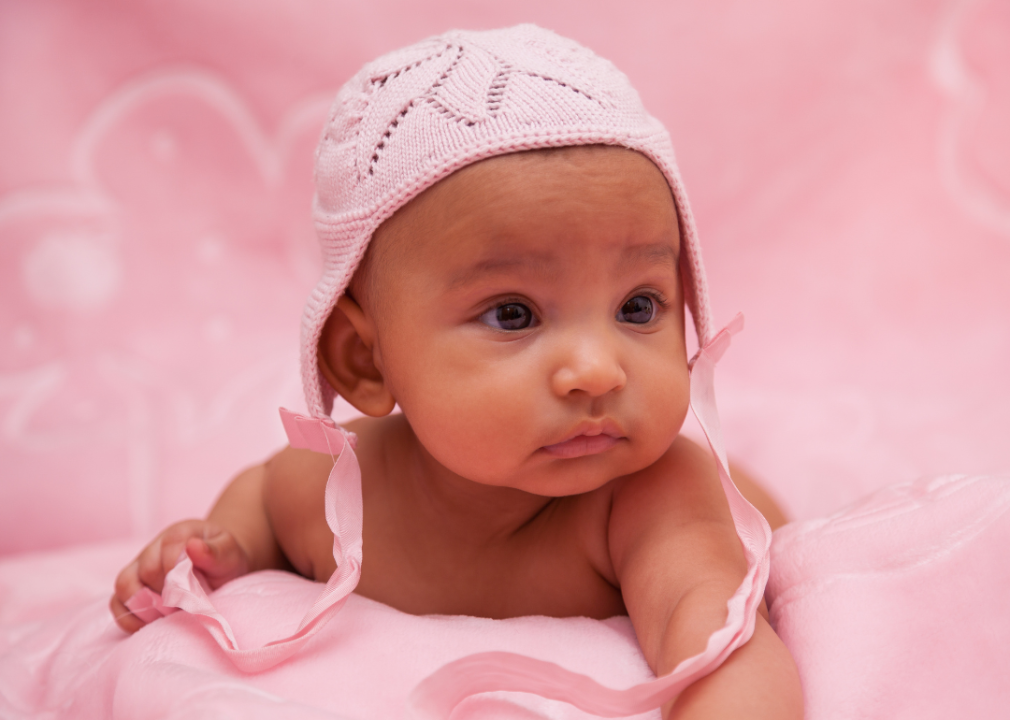 African American baby girl in pink hat. 