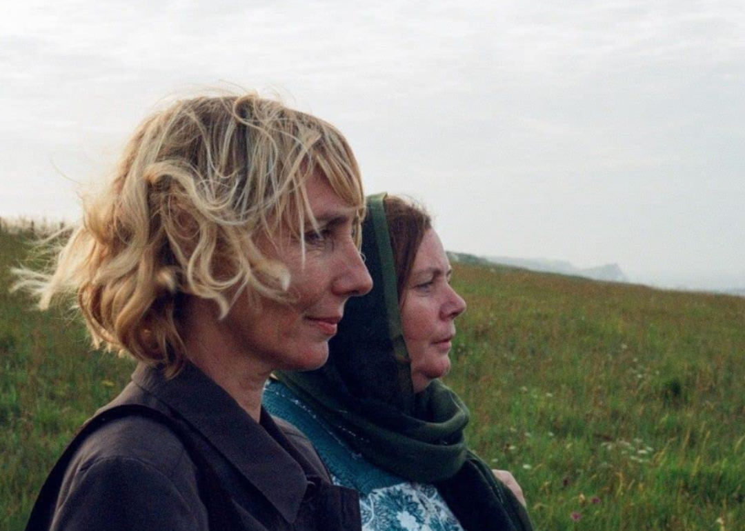 Nathalie Richard and Joanna Scanlan standing in a field in After Love.