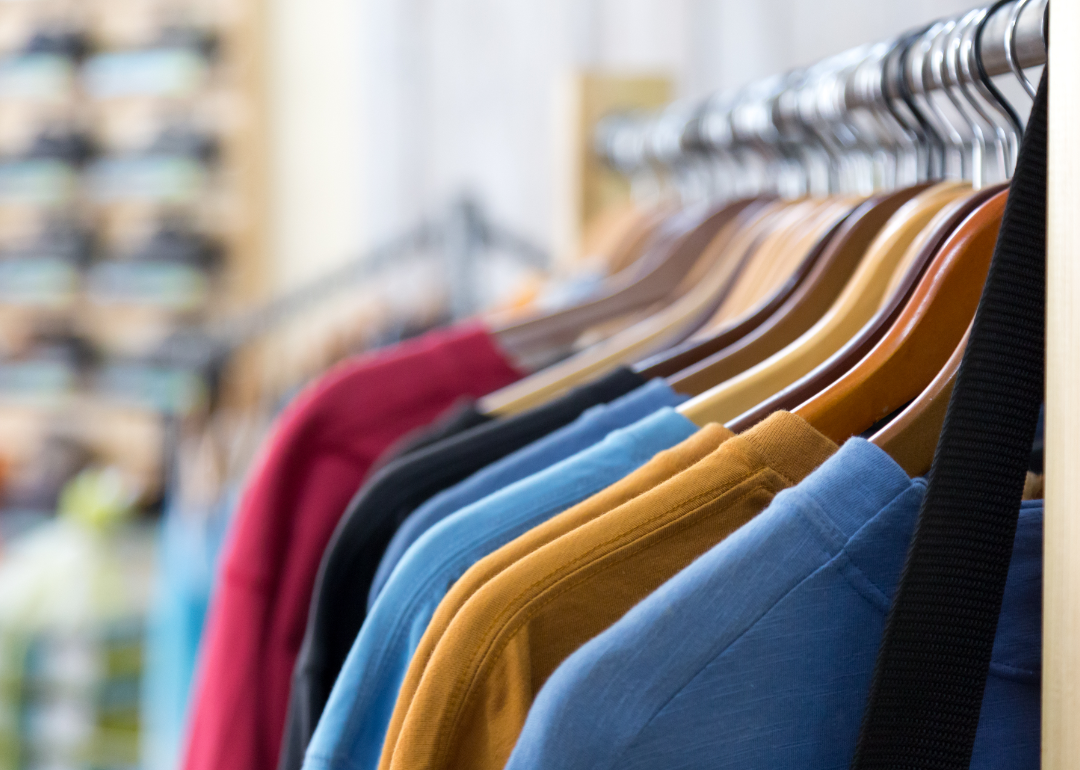 Sweaters hanging on a rack in a store