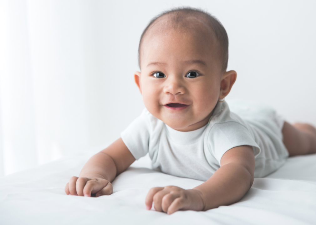 A smiling Asian baby boy. 