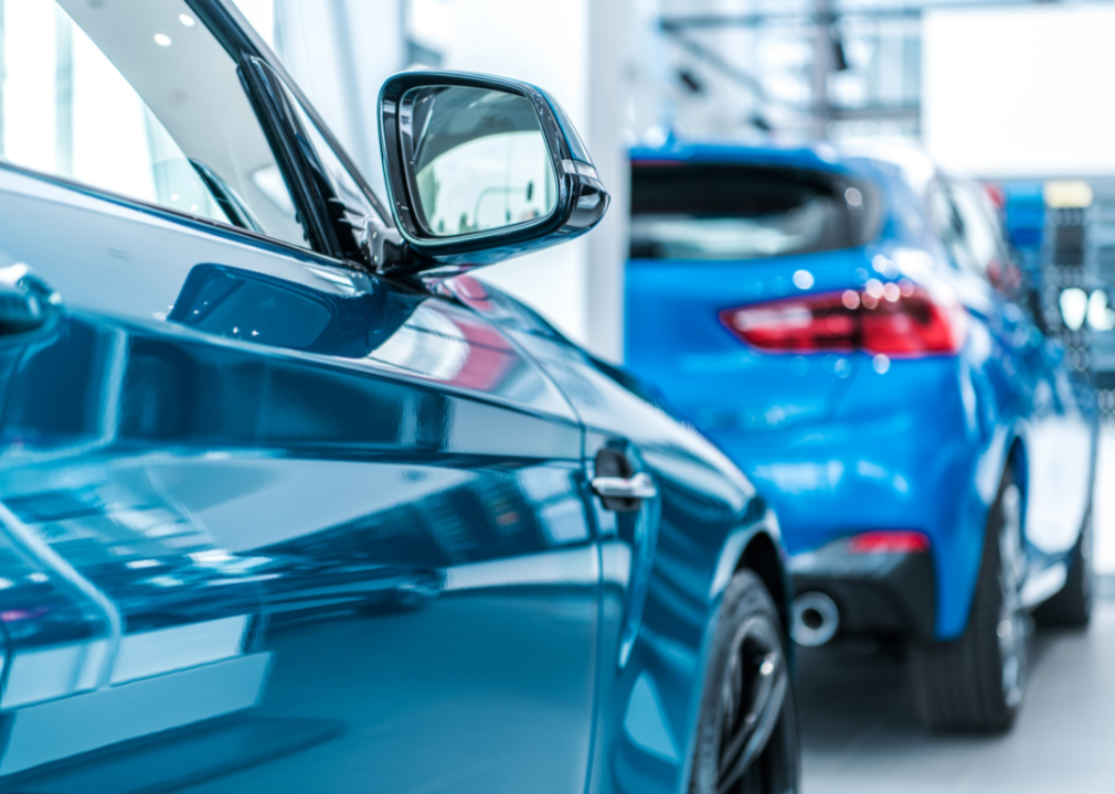 Two new blue carson display in a dealership showroom