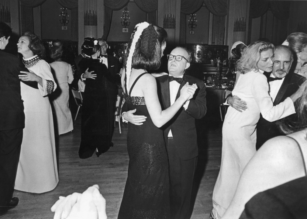 Truman Capote dances with a guest at his Black and White Ball at the Plaza Hotel