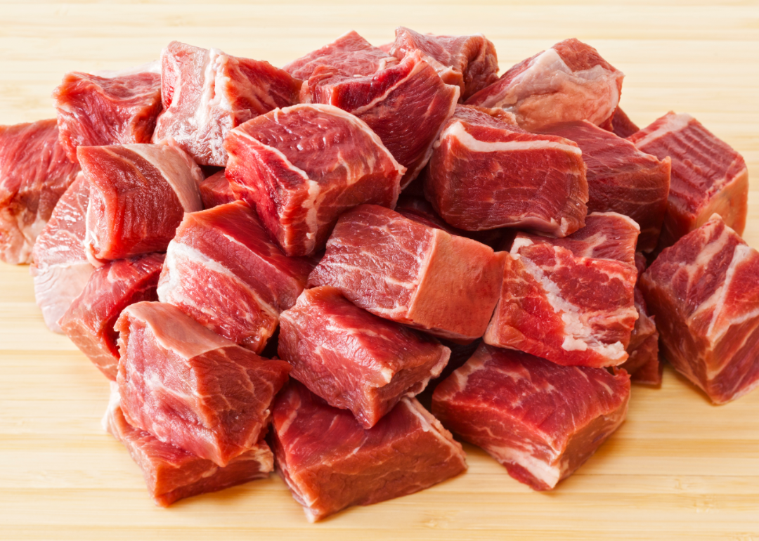 Cubed beef on a cutting board