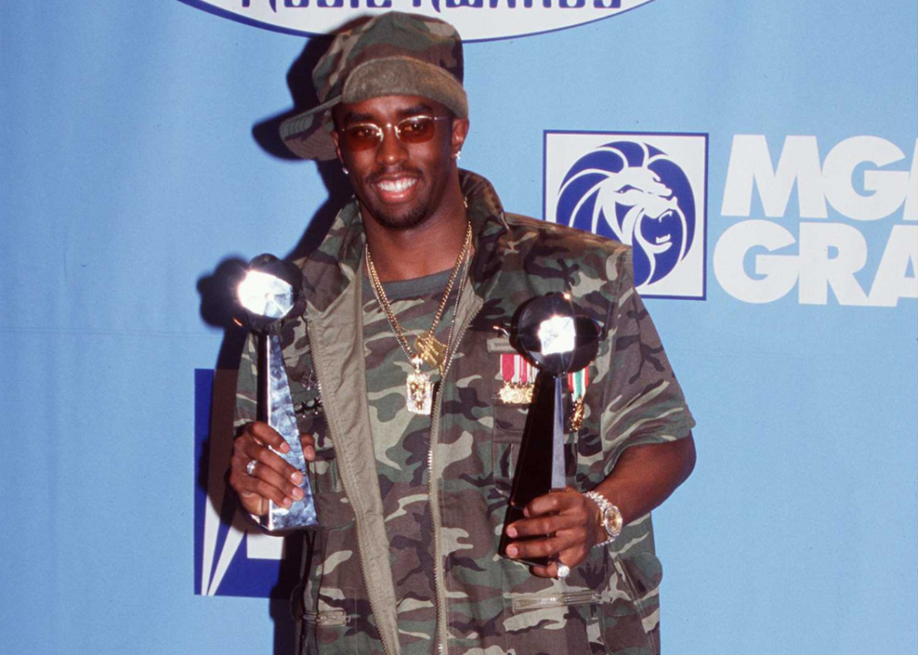 Puff Daddy poses with awards.