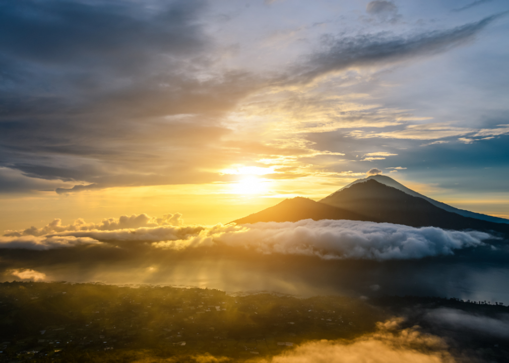 The sun setting over mountains. 