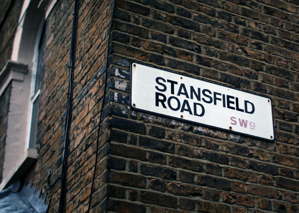 Stansfield Road sign on side of brick wall. 