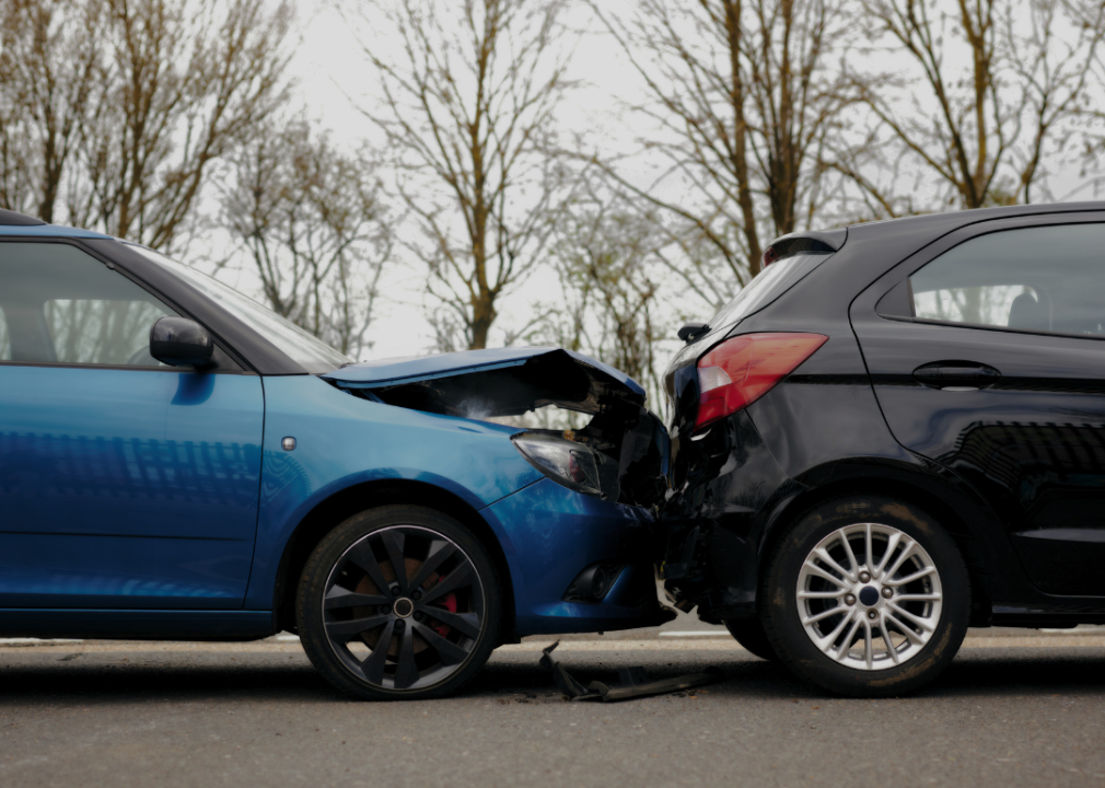 A close up of two cars crashed in an accident.