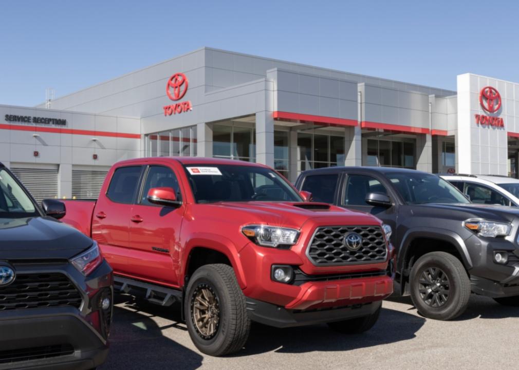 Tacoma trucks in front of a dealership.