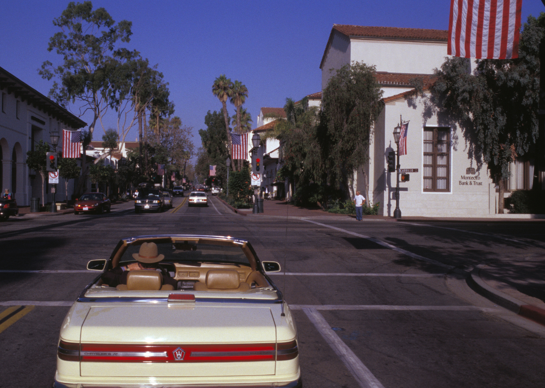 A car driving down Rue de Santa Barbara in 1999.