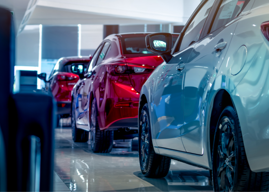 Shiny new cars in a dealership showroom