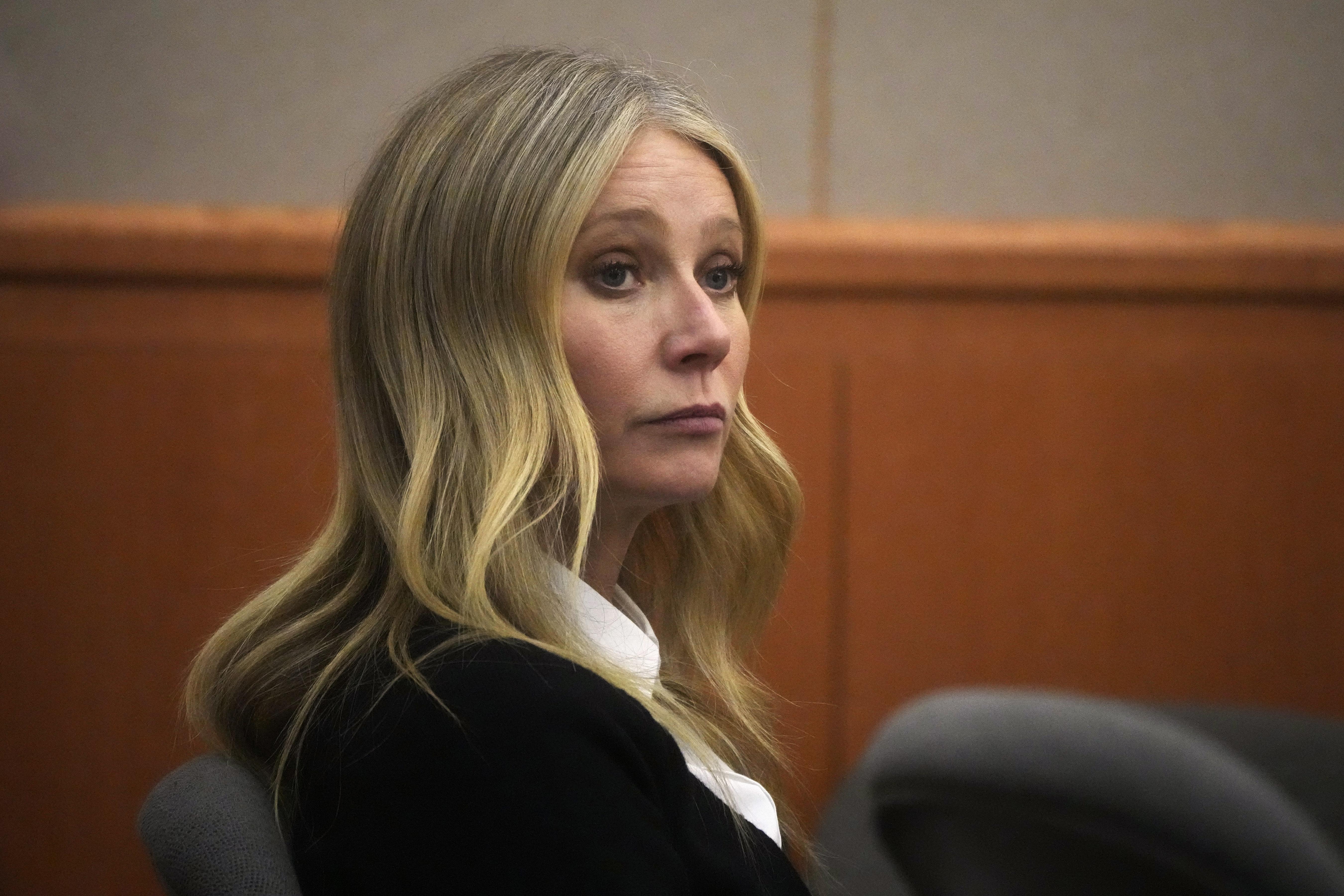 Gwyneth Paltrow in a black suit.