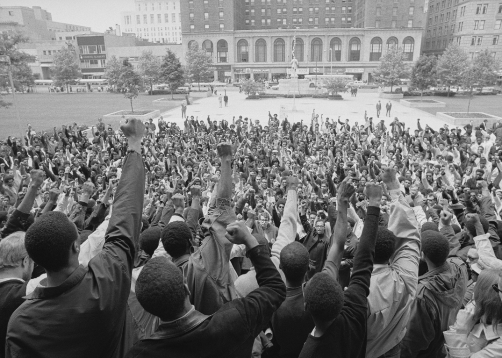 Students from Central State University give the black power salute during a meeting on the steps of the State House