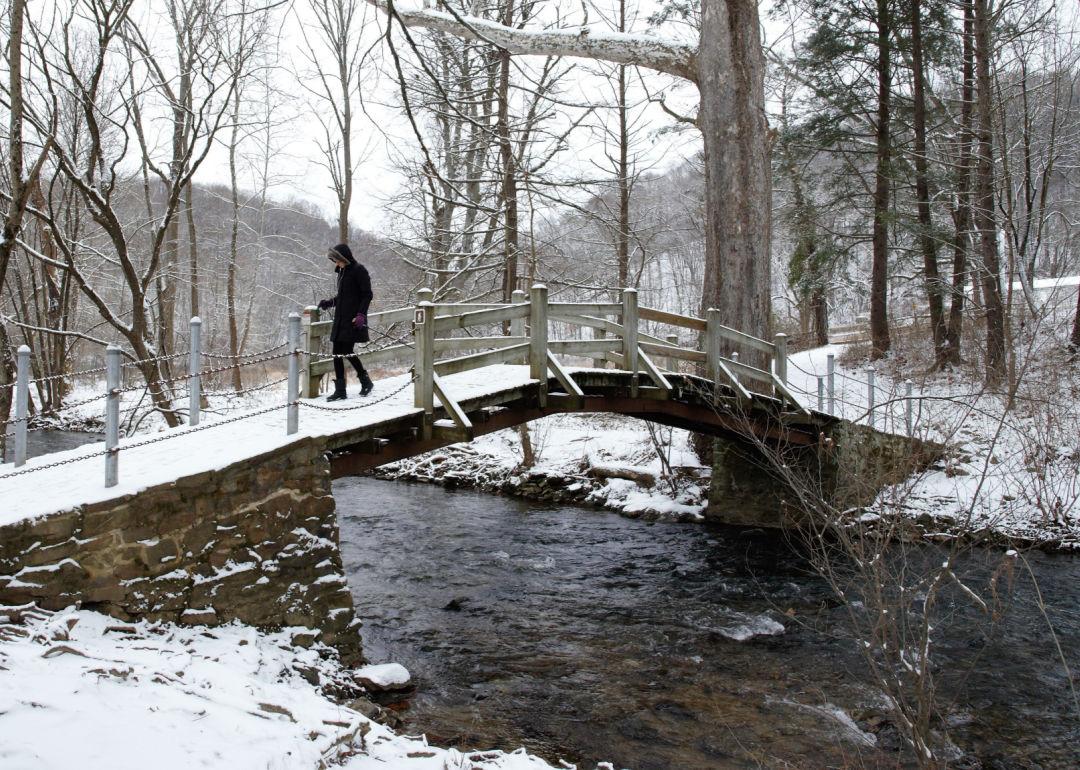 Snow blankets footbridge over Valley Creek in Valley Forge
