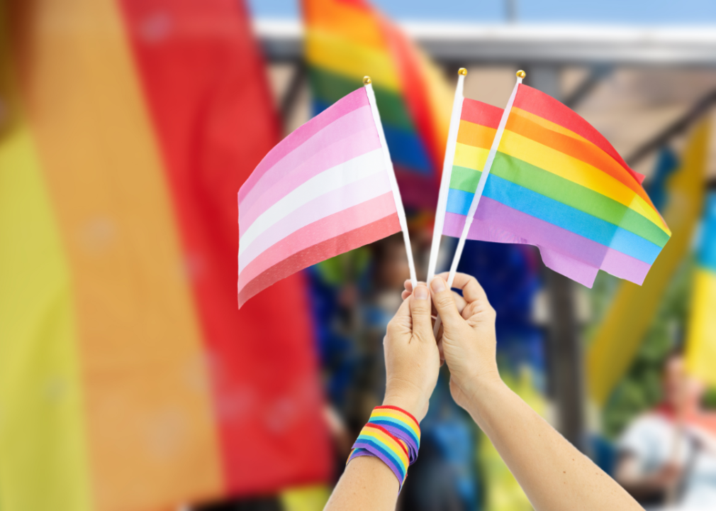 Flags fly at a pride celebration.