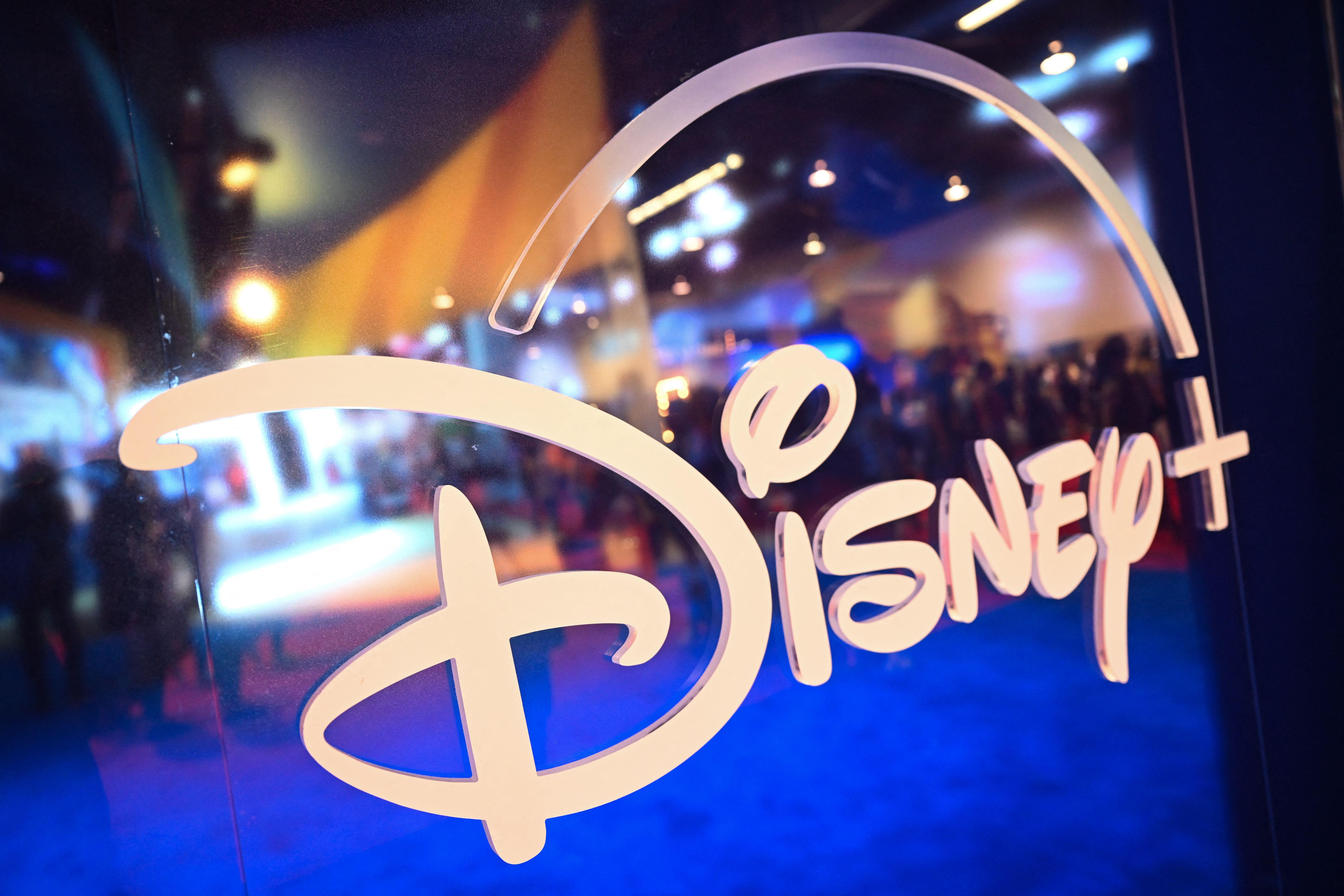 The Disney logo on a glass door.
