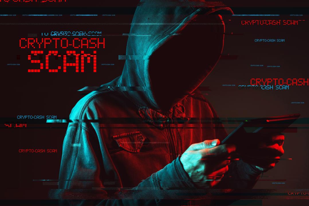 A hooded figure with a hidden face, using a tablet or similar device. The background is dark and features red and blue lighting effect. There are digital glitch effects throughout the image.