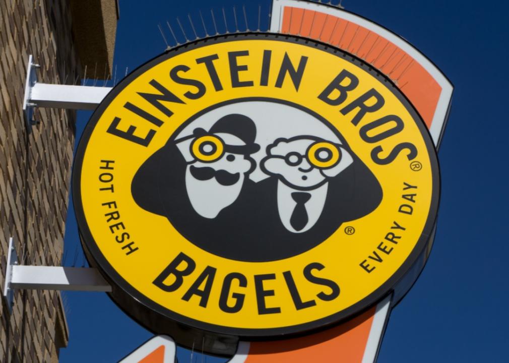 Einstein Bros. Bagels sign attached to a building.