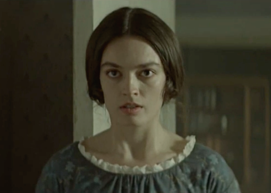 A close up of Emma Mackey as Emily Brontë.