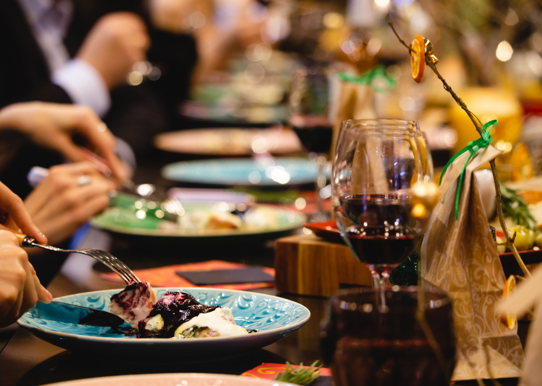 People dining on colorful plates in a restaurant