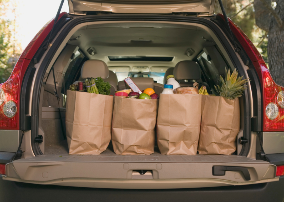 Full grocery bags in the trunk of a car