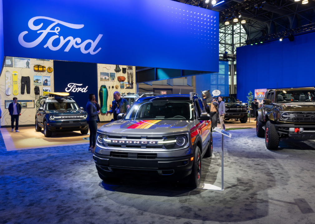 Ford hybrid vehicles in a showroom.