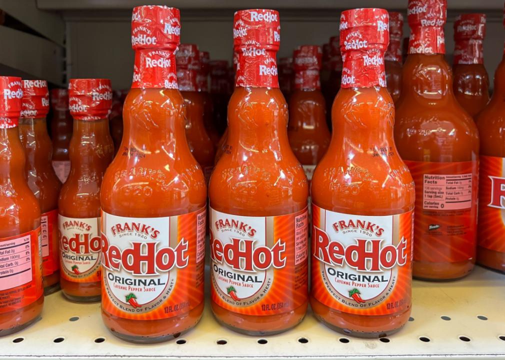 Several bottles of Frank's RedHot hot sauce at a local grocery store.