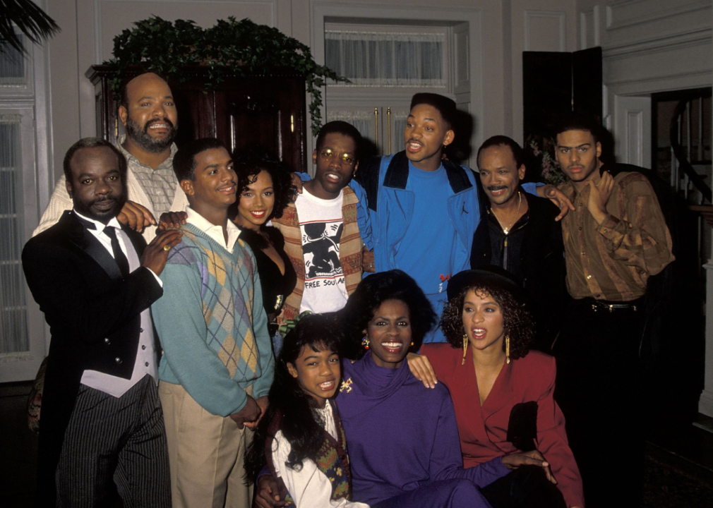 Joseph Marcell, James Avery, Alfonso Ribeiro, Tyler Collins, Kadeem Hardison, Will Smith, Quincy Jones, Al B. Sure!, Tatyana Ali, Janet Hubert and Karyn Parsons pose for a group photo on a break from filming The Fresh Prince of Bel-Air in 1990.
