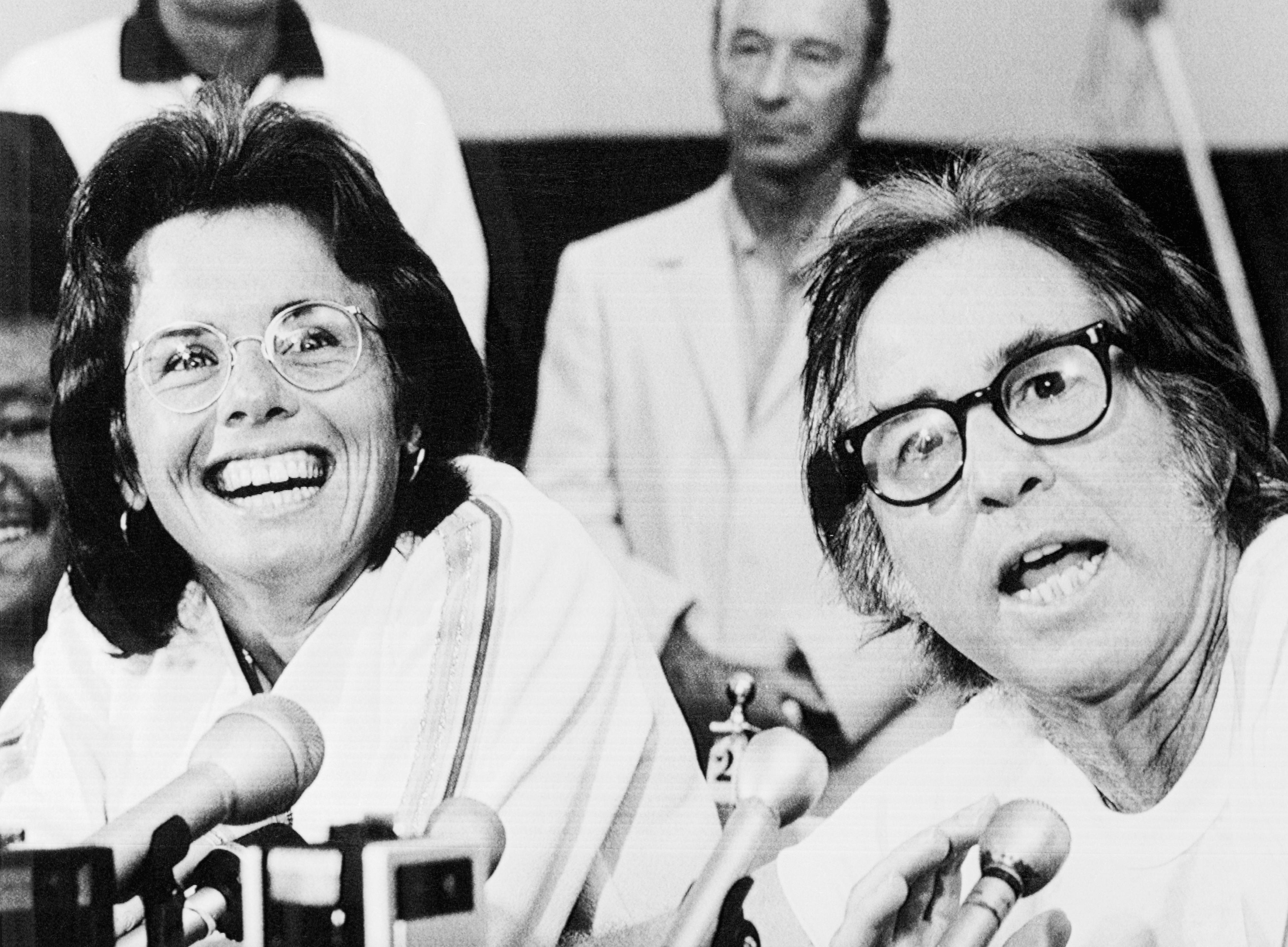Bobby Riggs and Billie Jean King pose for the press before tennis match.