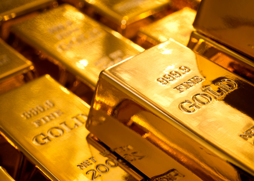 A pile of gold bars sitting next to each other. 