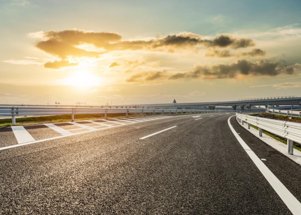 Asphalt highway and beautiful sky cloud landscape at sunset.