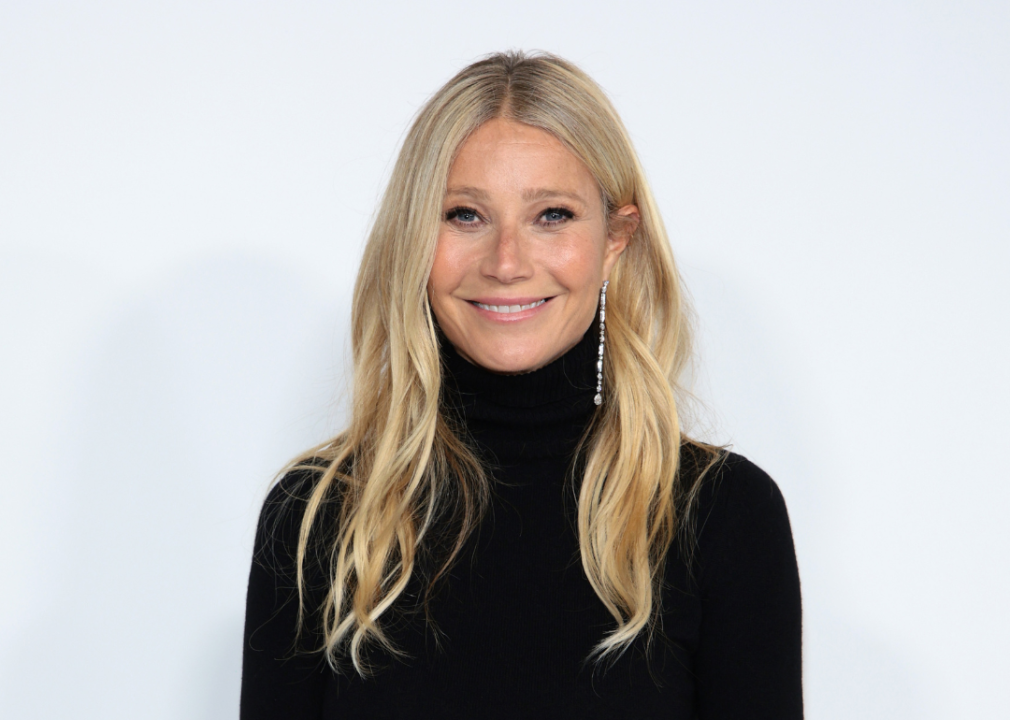 Gwyneth Paltrow poses at a 2023 event in front of a white background.