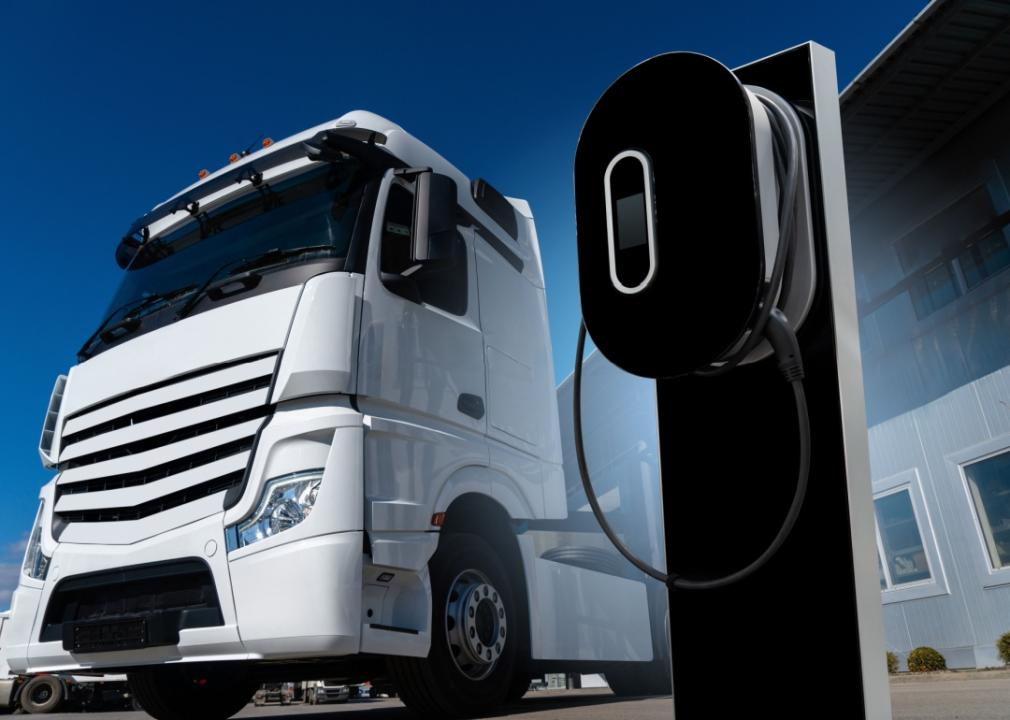 An electric freight truck at a charger.