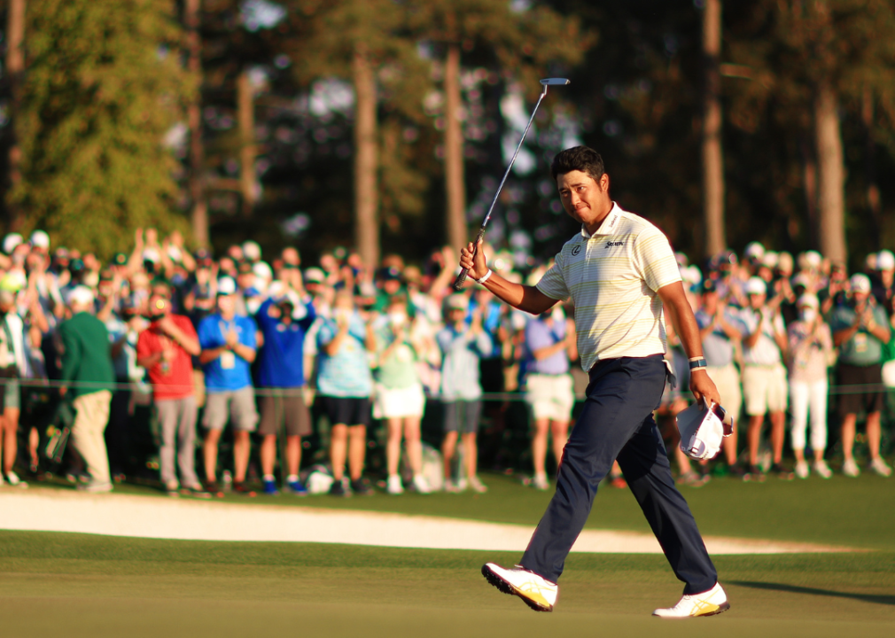 Hideki Matsuyama of Japan celebrates on the 18th green after winning the 2021 Masters.